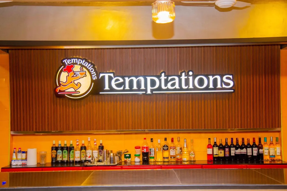 Temptations logo wall above the bar selection